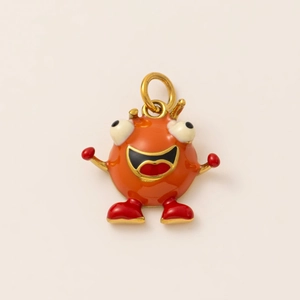 Detail eines süßen orangen Monster-Anhängers mit 18K Vergoldung und Emaille-Finish