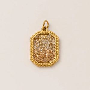 Detail of 18K gold plated rectangular pendant with shimmering inlaid zircon crystals