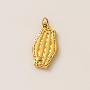 Macro shot of 18K gold plated moon wine cup pendant with heart detail and matte finish