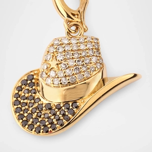 Detail of a 18k gold cowboy hat pendant with sparkling black and white pave crystals