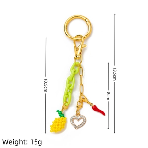Detailed view of colorful summer keychain with pineapple, heart and chili charms
