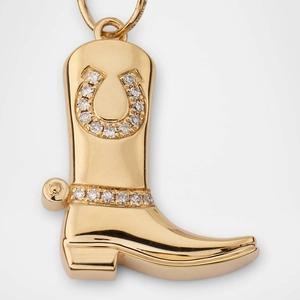 Detailed view of an 18K gold-plated cowboy boot pendant with horseshoe stone inlay