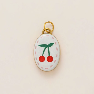 Oval 18K gold plated stainless steel cherry pendant with white enamel floral design