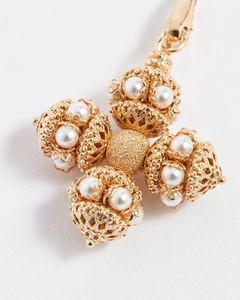 Detail of 14k gold hollow cross pendant with pearls and secure lobster clasp