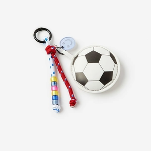 Detail view of soccer-themed keychain featuring mini coin purse and woven lanyard