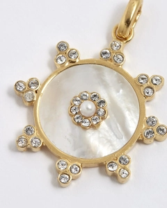 Detail of sunburst pendant with white mother of pearl, small pearl and crystals