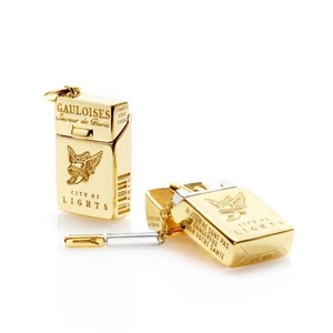 Macro shot of gold-plated 925 silver cigarette box pendant with open lid detail