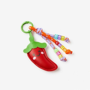 Close-up of red chili keychain with colorful letter beads and woven cord detail