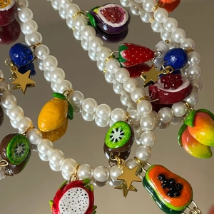Handmade pearl bead jewelry with colorful resin fruit charms and golden stars charms