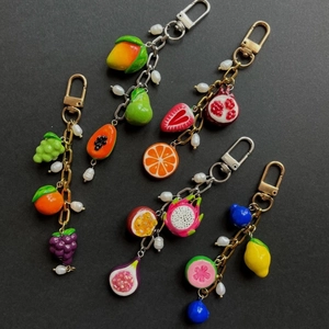 Fruit keychain collection with realistic resin strawberry and grape pendants with pearls