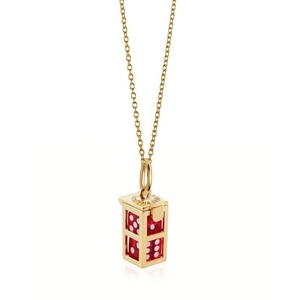 Detailed close-up of a golden rectangular frame pendant with red dice and chain