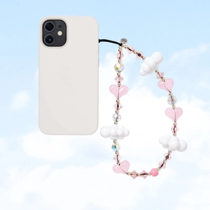Detailed view of handmade beaded phone strap with pink heart and white cloud charms