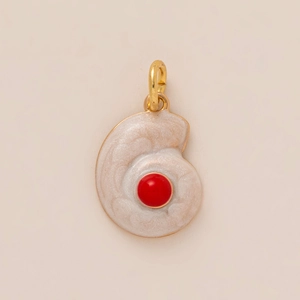 Golden nautilus shell charm with white pearl enamel and center red gemstone inlay