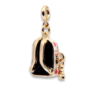 Detail of backpack-shaped gold plated jewelry charm with black enamel and star patterns