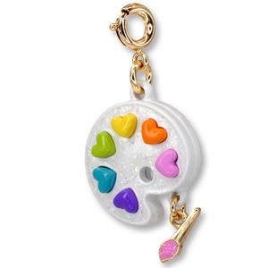 Macro shot of artist palette charm with colorful hearts and golden paintbrush pendant