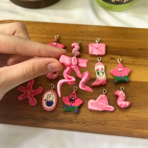 Pink resin charms collection featuring ribbon, rabbit and star motifs for DIY jewelry