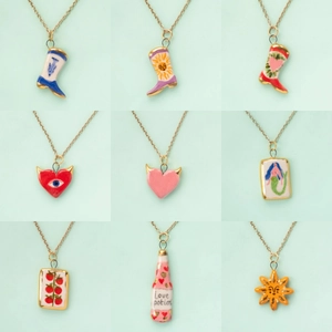 Collection of nine hand-painted mermaid and heart charms on delicate gold chains