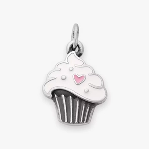 Macro view of cupcake charm with white enamel icing and pink heart decoration