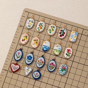 Charming assorted ceramic charms with floral patterns and gold frames for DIY jewelry