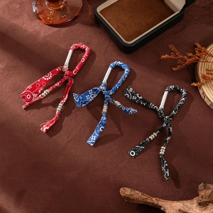 Bohemian style keychain set with metal carabiners and geometric pattern fabric straps
