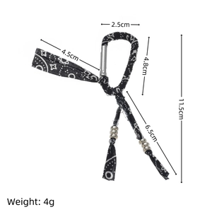 Detail of ethnic pattern fabric keychain with metal beads and spring clasp, dimensions shown