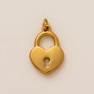 Macro view of 18K gold plated heart-shaped locket pendant with a brushed metal finish