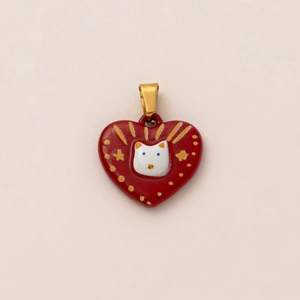 Close-up of red heart-shaped cat pendant in 18K gold plated stainless steel