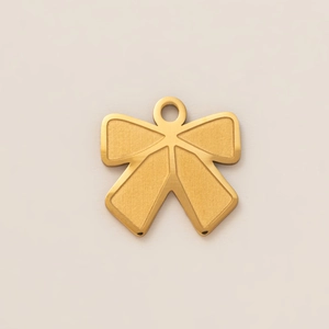 Detailed macro shot of 18K gold plated stainless steel bow pendant with matte finish