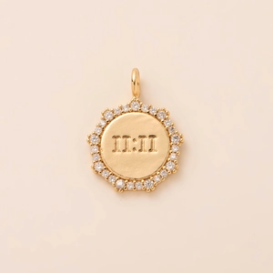 Macro view of gold plated round 11:11 angel number pendant with sparkling zirconia stones