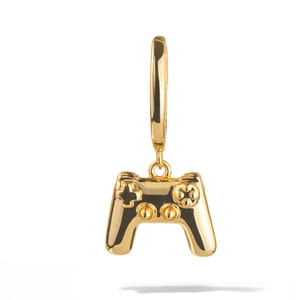 Detail of 18K gold-plated gamepad pendant with high-polished metallic finish