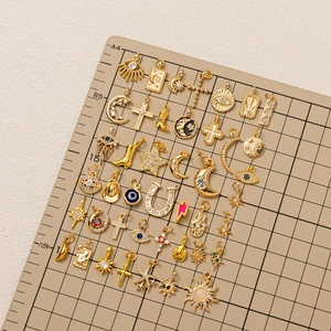 Pendentifs DIY dorés à la mode avec croix, œil maléfique et symboles célestes pour bijoux
