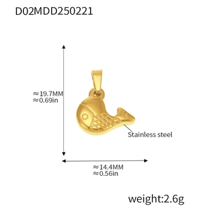 Detail showing dimensions of a gold fish pendant made of polished stainless steel