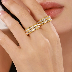 Gold plated stainless steel rings with double row zircon pavé stones on a finger