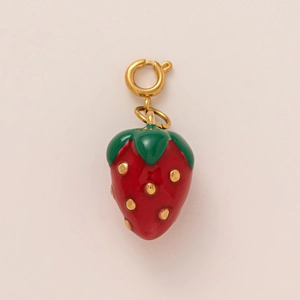 Macro detail of strawberry pendant with red enamel finish and 18K gold-plated spring clasp