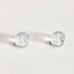 Macro shot of clear silicone earring back replacements for securing jewelry posts