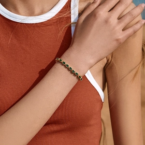 Luxury gold-plated tennis bracelet with oval green emerald-style gemstones for women