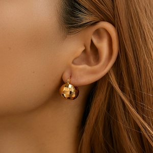 Unique 18K gold hollow basket cage earrings with faceted sphere drops and modern ear clips