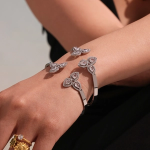 Luxe silver stainless steel open bangle with zircon-studded petals and teardrop accents
