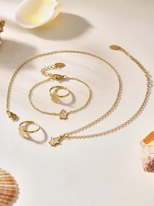 Detailed set of gold-plated stainless steel unicorn jewelry with colorful enamel accents