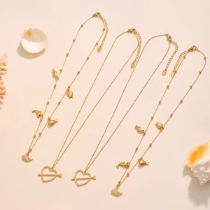 Golden ocean series necklace set with dolphin and turtle pendants and zircon accents
