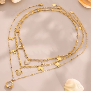 Gouden gelaagde roestvrijstalen ketting met dierlijke bedels en schelpdecoratie