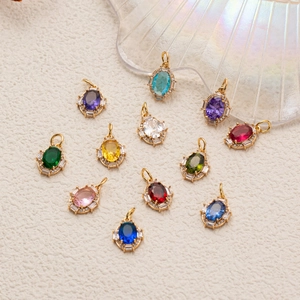 Oval birthstone pendants with gold plating and cubic zirconia in various vibrant colors