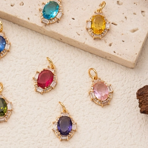 Oval gemstone pendant collection with birthstones in gold setting and crystal accents