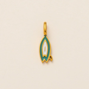 Macro shot of 18K gold plated surfboard charm with green and white enamel details