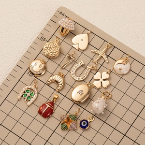 Assorted 18K gold plated DIY pendant charms including heart and clover designs