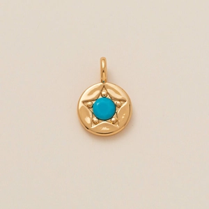 Pendentif doré avec cadre en étoile et pierre de zircon cubique bleu ciel ronde