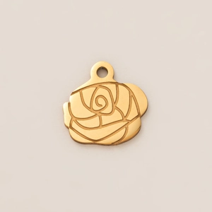 Detailed view of a gold rose pendant with deep-grooved texture and a round hanging ring