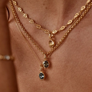 Three-layer gold stacking necklace with yellow, green and blue zircon birthstone pendants
