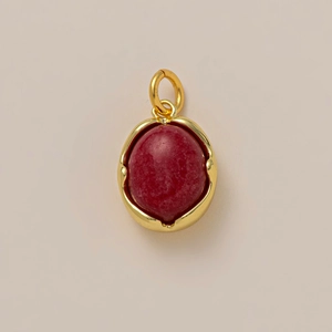 Detail of 18K gold plated pendant with oval red carnelian stone and sturdy jump ring
