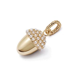 Detailed view of an acorn pendant with micro-pearl inlay and polished golden finish